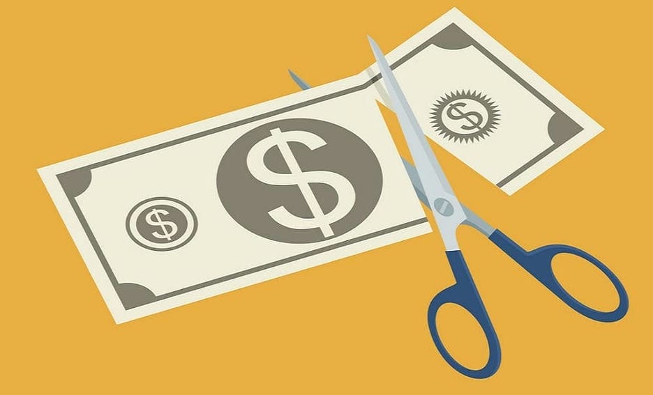 Graphic of scissors cutting a bill